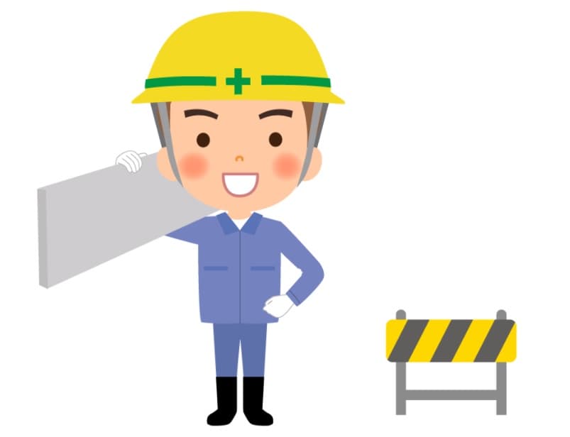 資材を肩に担ぐヘルメット姿の作業員のイラスト